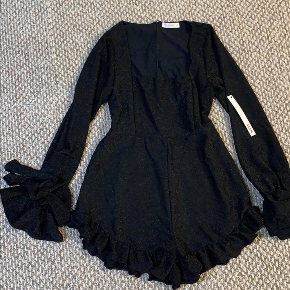 Sparkly Black ruffle romper with bow